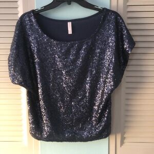 Pretty blue sequin top with plain fabric in back.